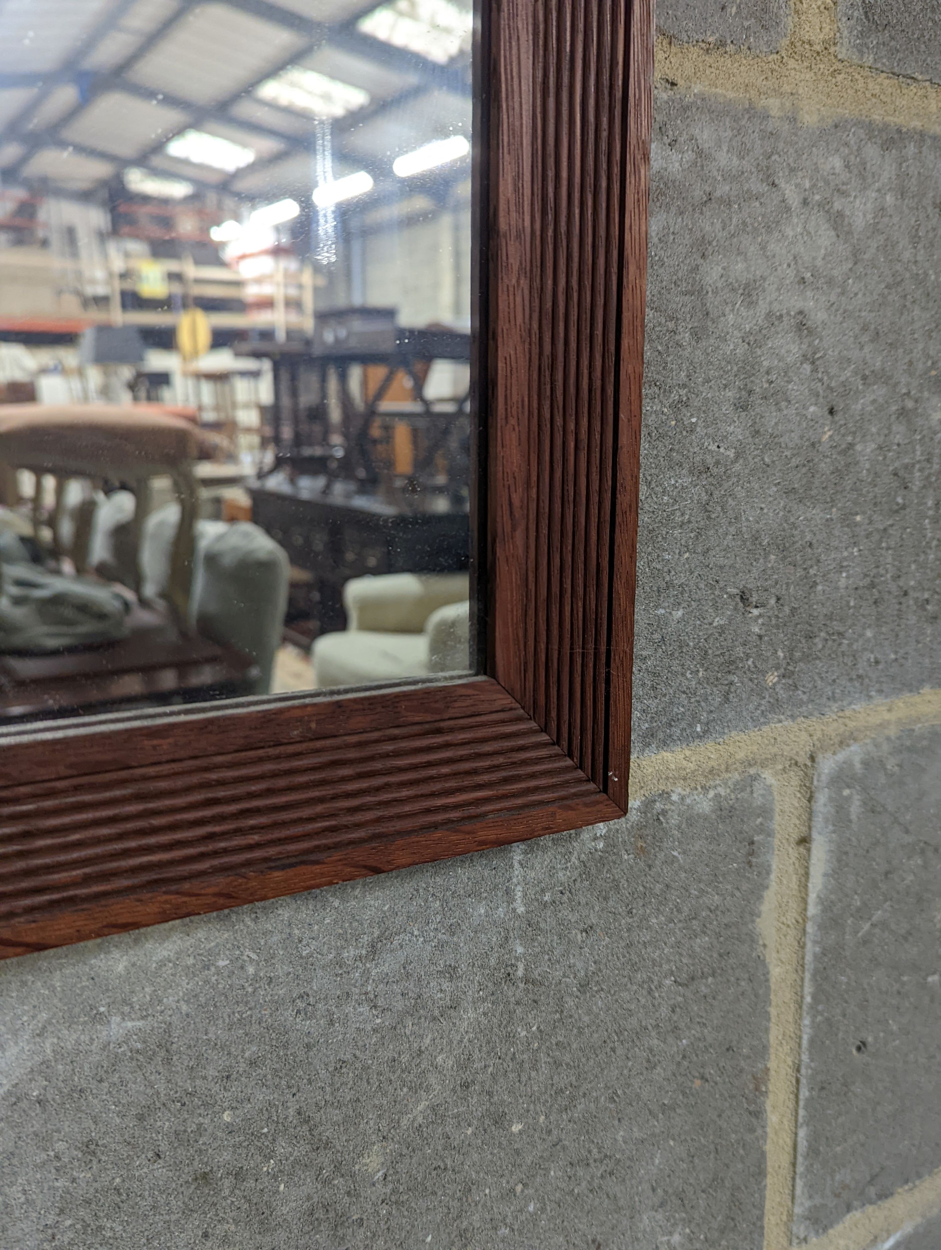 An oak framed rectangular wall mirror with fluted border, width 79cm, height 99cm